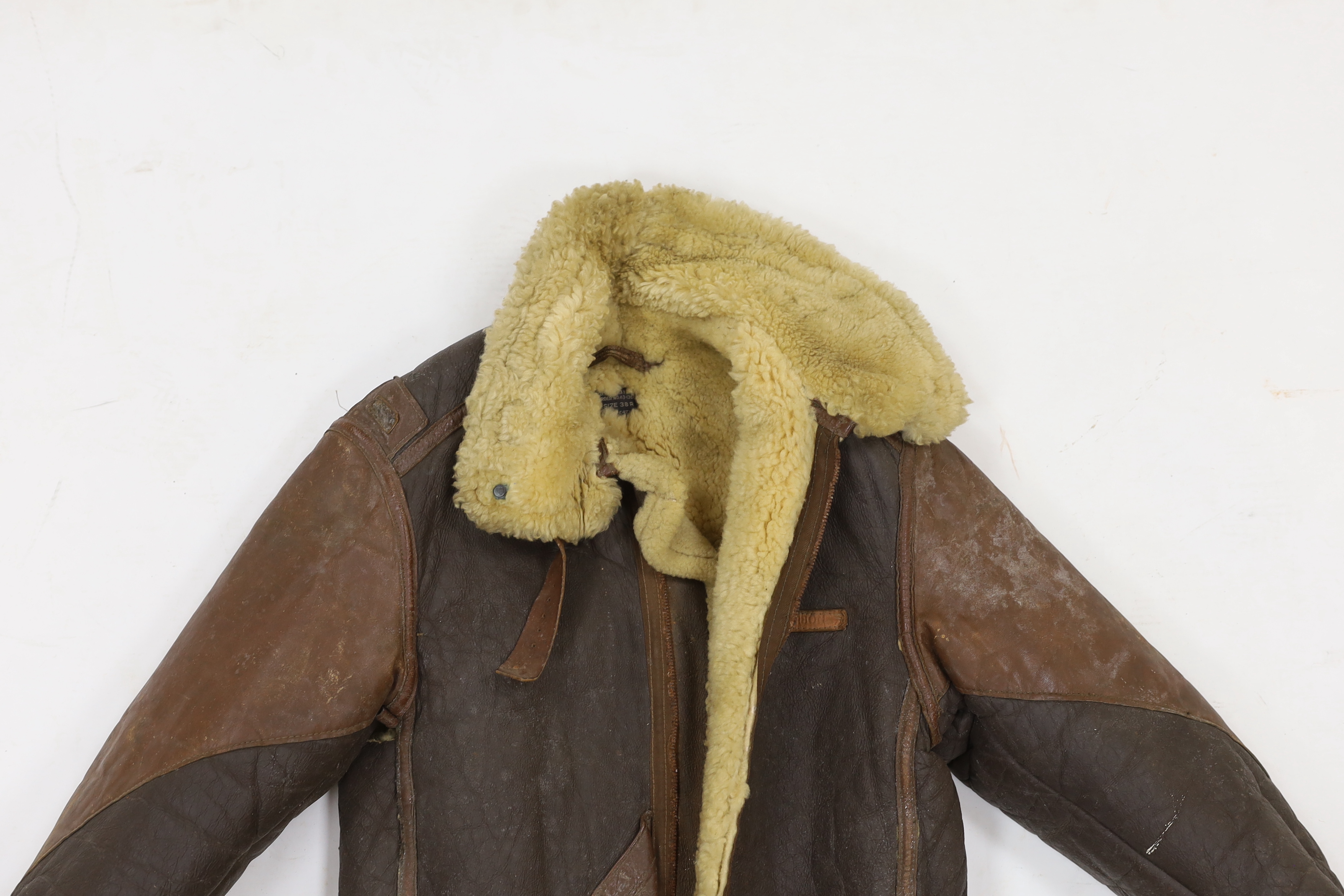 A United States Air Force Type B-3 sheepskin flying jacket, with label to collar reading; ‘Type B-3 DWG. No.33H5595 AC Order No.43-13609-AF Size 38R Property Air Force U.S. Army’